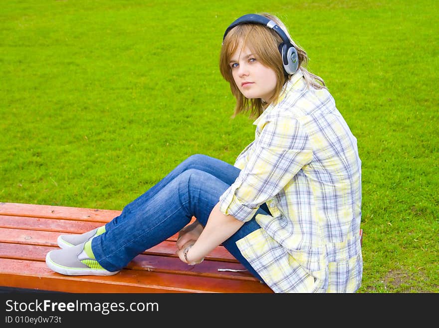 The young attractive girl with headphones. The young attractive girl with headphones