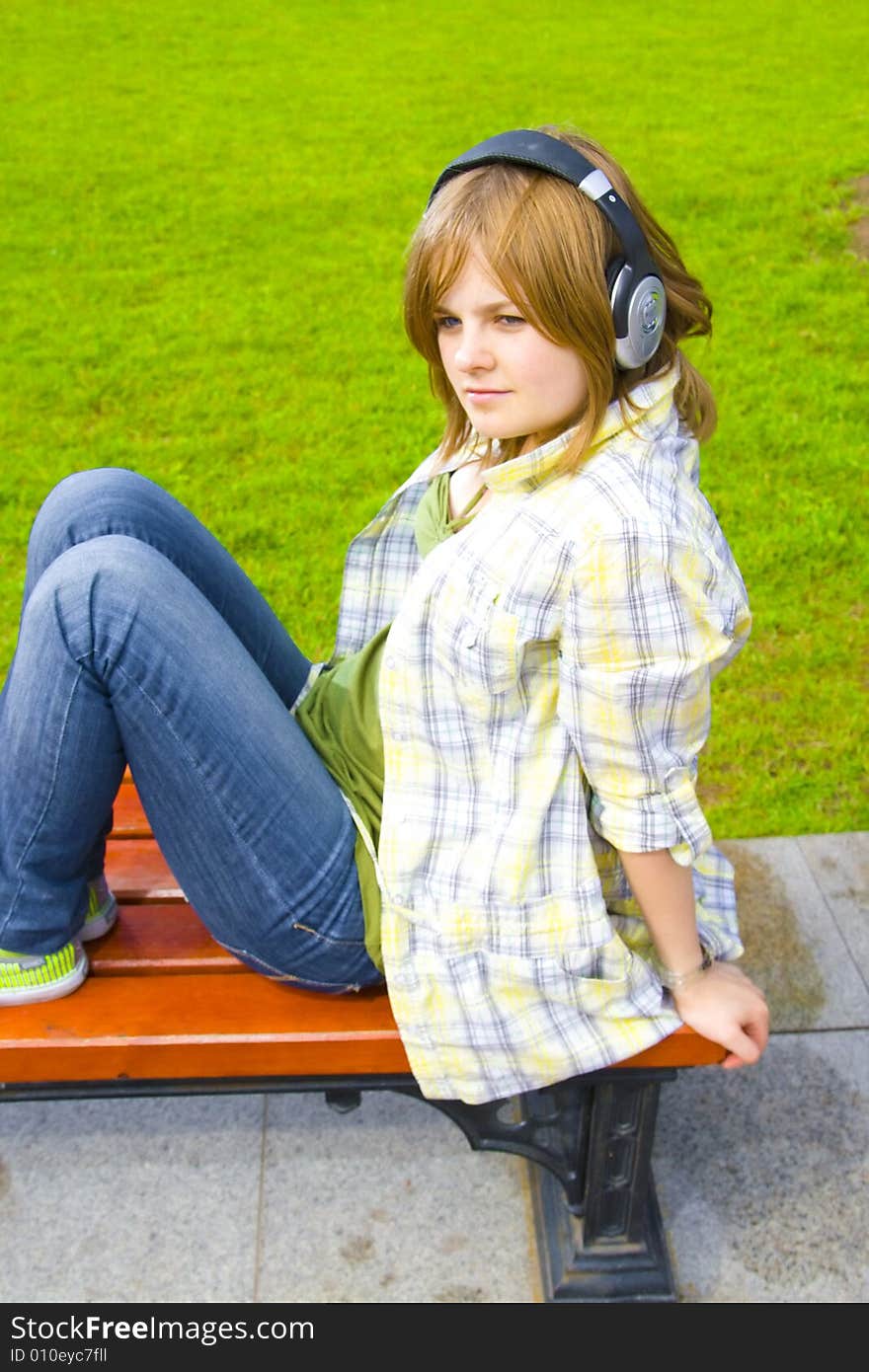 The young attractive girl with headphones. The young attractive girl with headphones