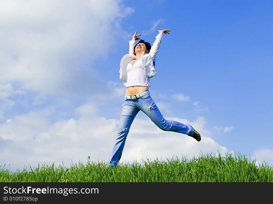 Happy young woman is jumping