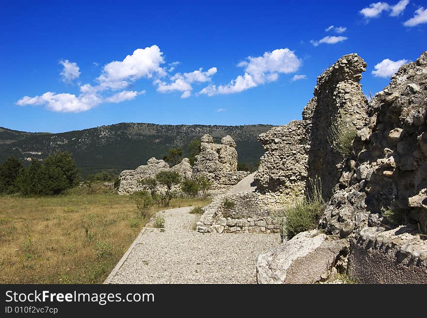 Some ruins in mountains landscape with blue sky. Some ruins in mountains landscape with blue sky