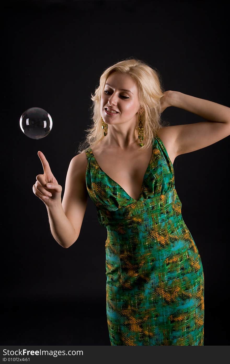 Girl with bubble on black background