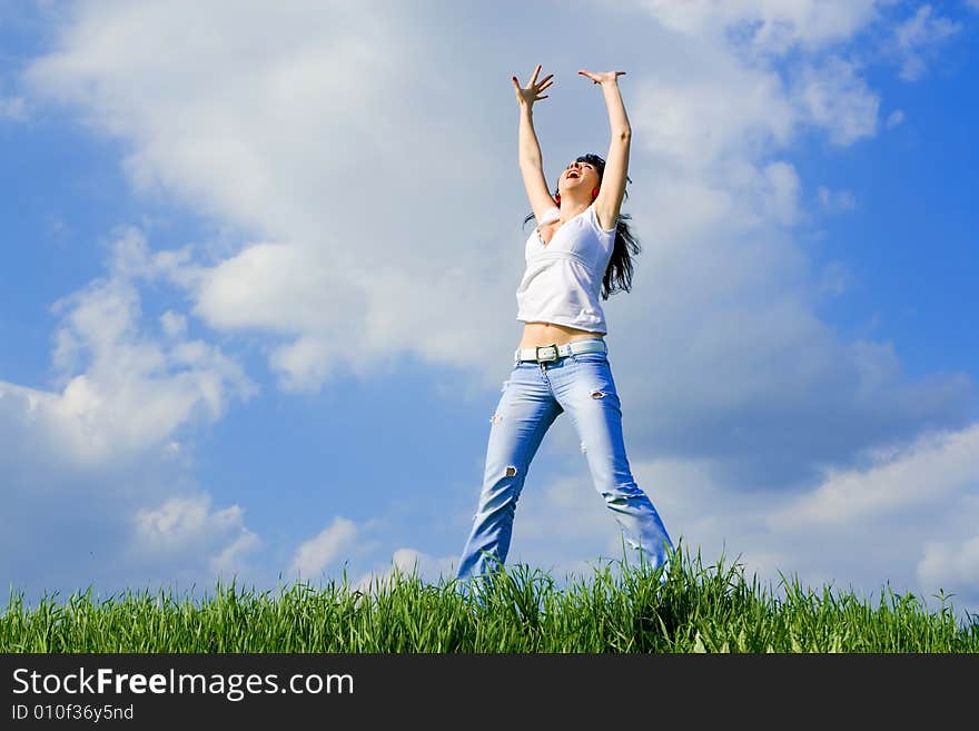 Happy young woman is jumping