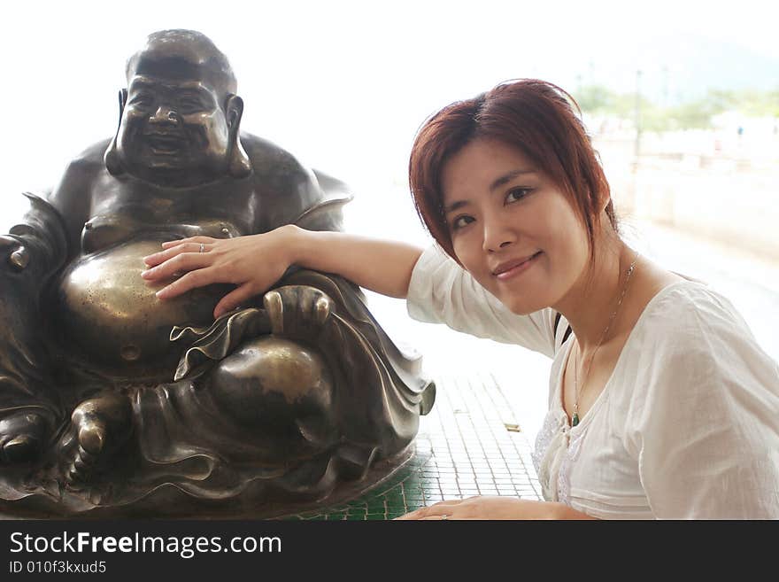 Taken in Hongkong at the beach. On the picture is also the buddha, who brings people happiness. Taken in Hongkong at the beach. On the picture is also the buddha, who brings people happiness.