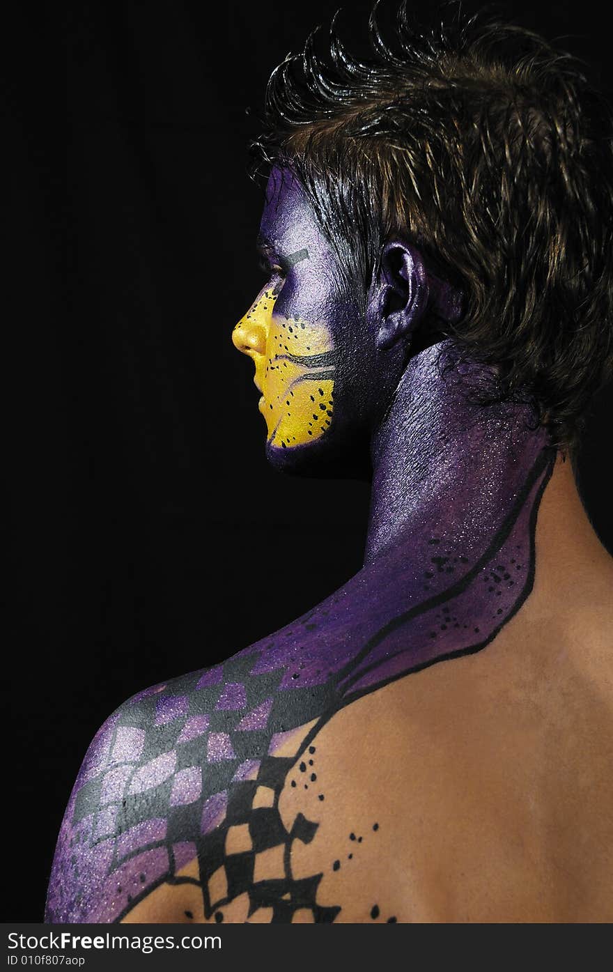 Portrait of young model wearing artistic bodypaint drawing