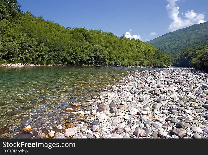 Rocks of a quiet mountain river in summer time. Rocks of a quiet mountain river in summer time.