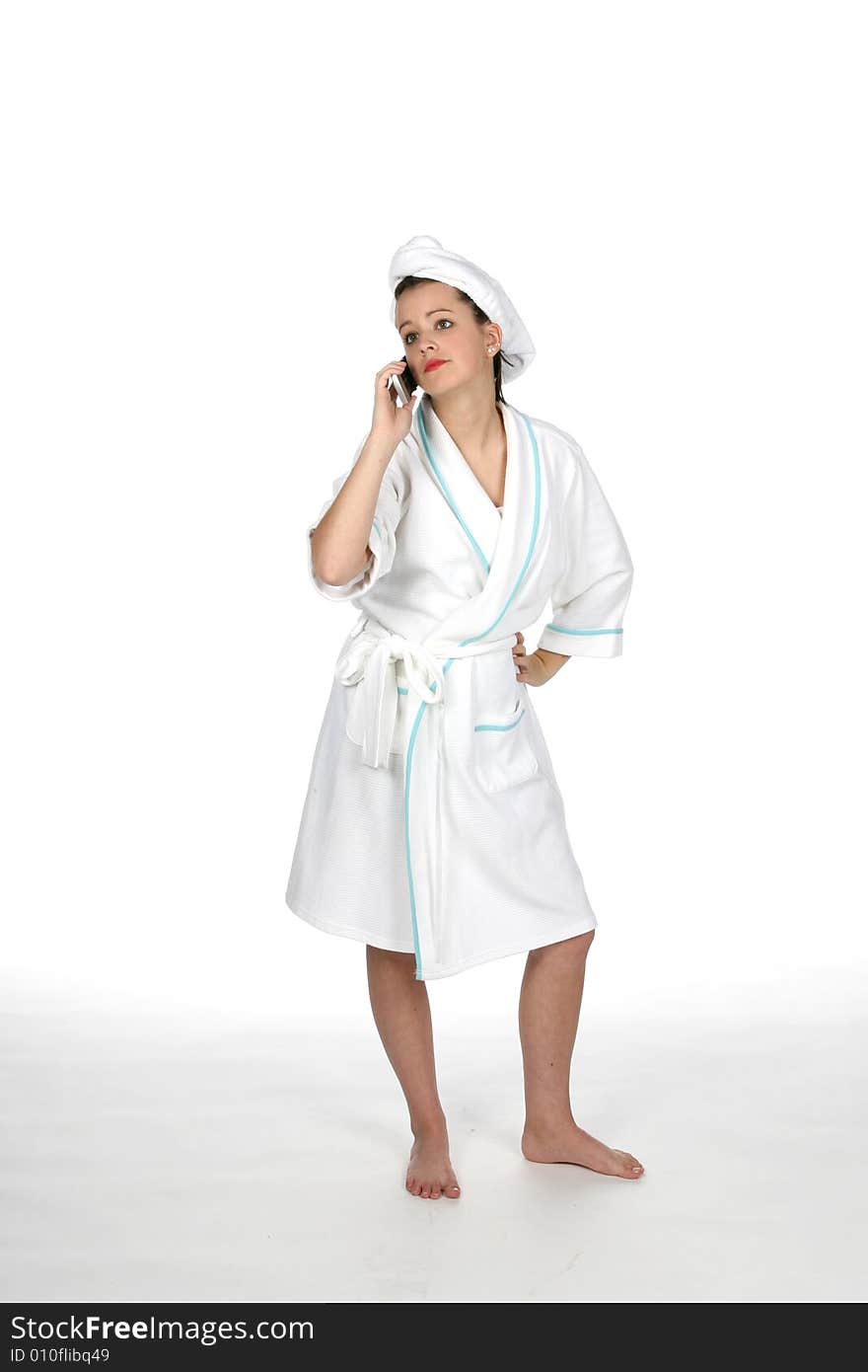 Teen in towel and robe like at the spa, on phone. Teen in towel and robe like at the spa, on phone