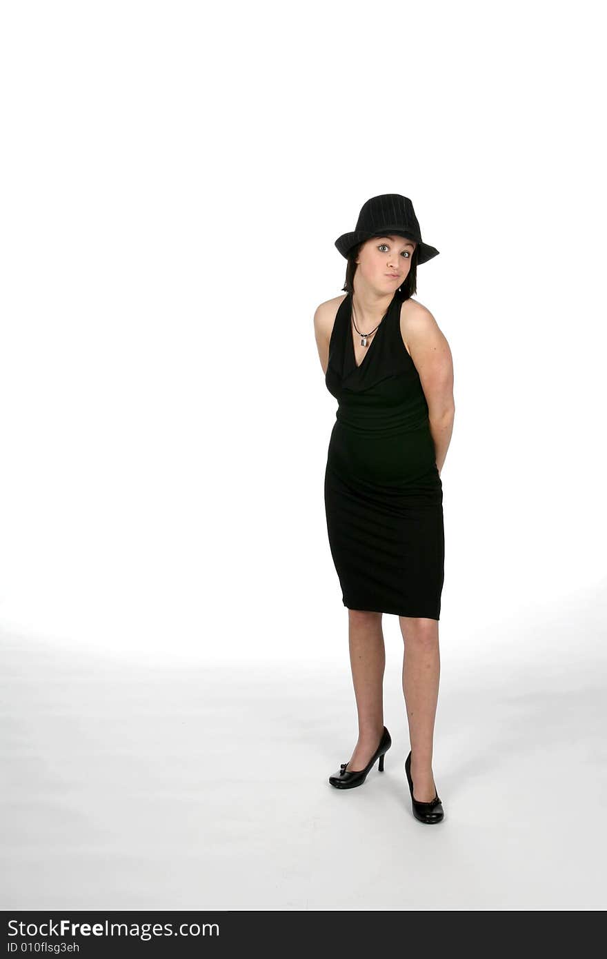 Pretty teenager in black dress and top hat. Pretty teenager in black dress and top hat