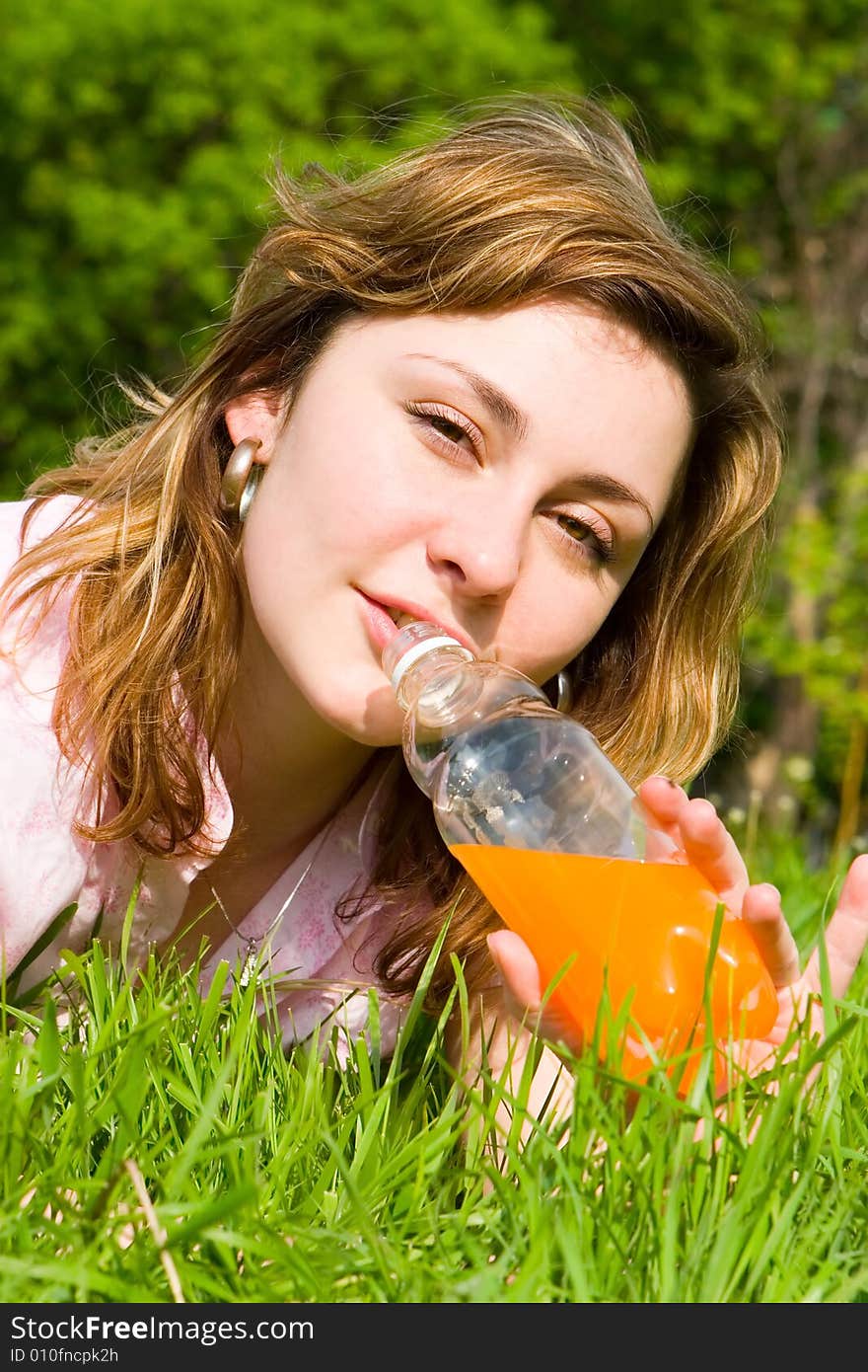 Pretty woman drinking juice