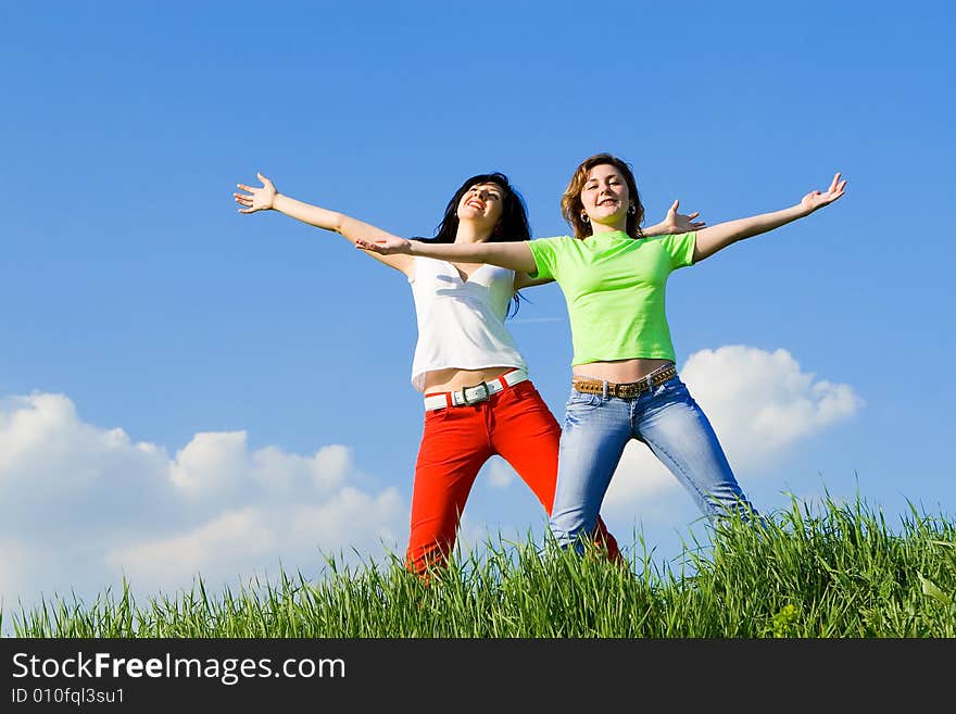 Two happy women dreams to fly on winds