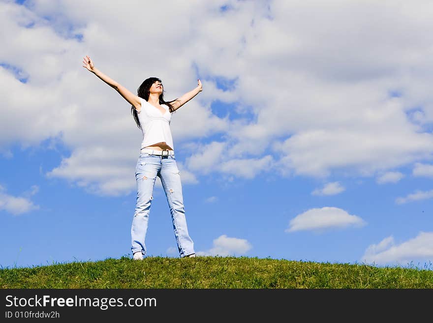 Happy young woman dreams to fly on winds. Happy young woman dreams to fly on winds