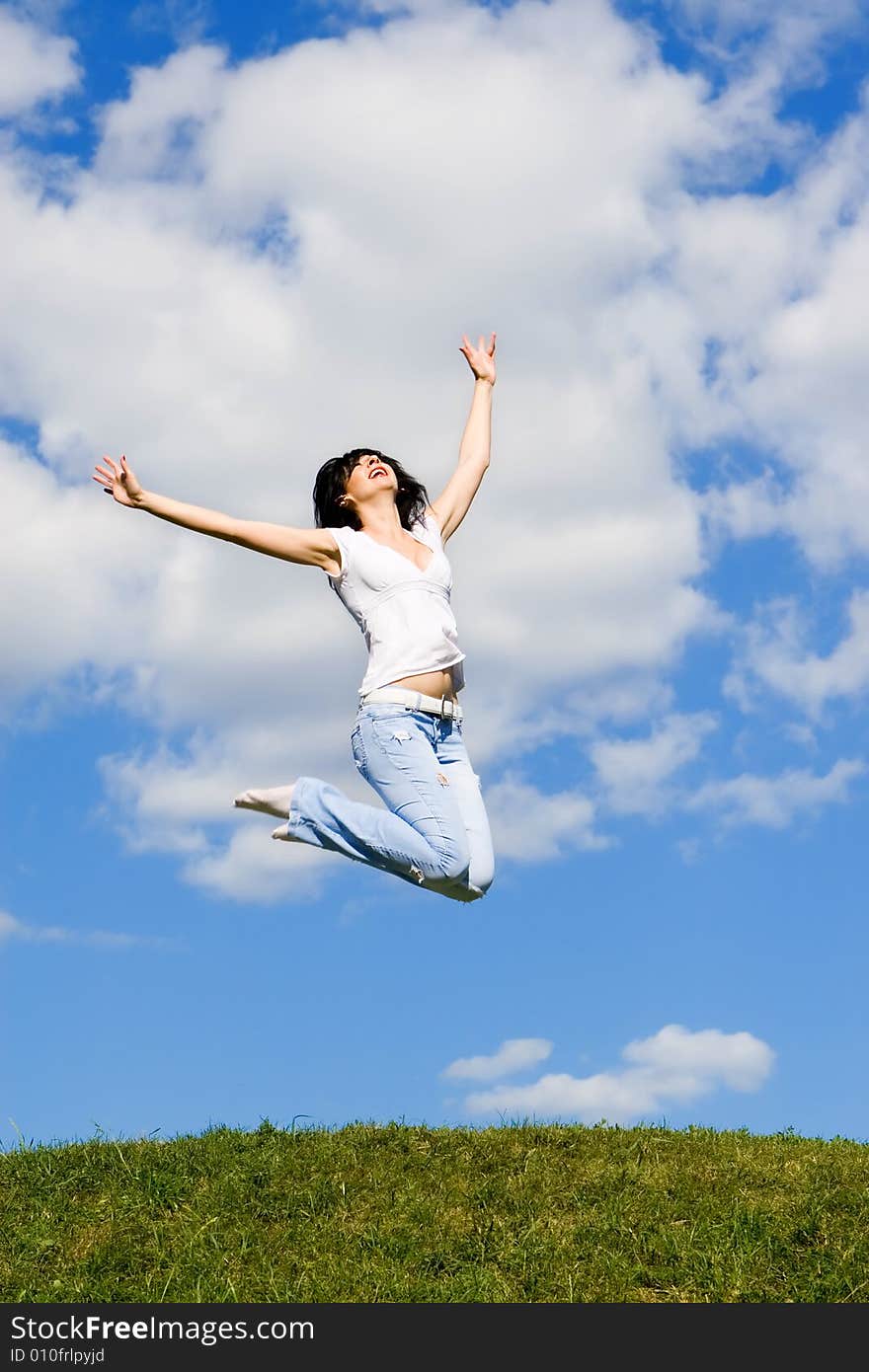 Expressive young woman is jumping. Expressive young woman is jumping