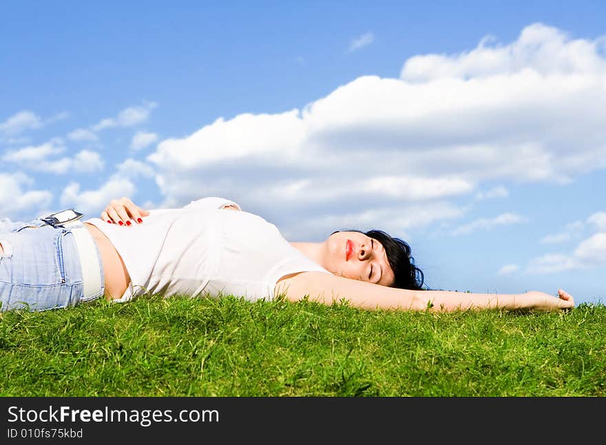 Woman Rest On The Green Grass