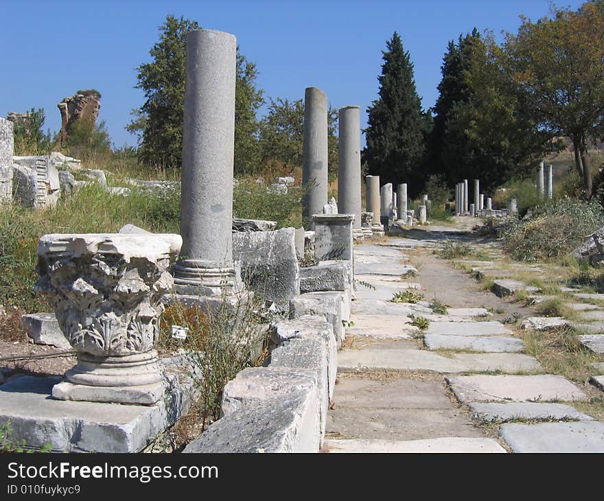 Ancient column lined roadway, in the city of Ephesus. Ancient column lined roadway, in the city of Ephesus.