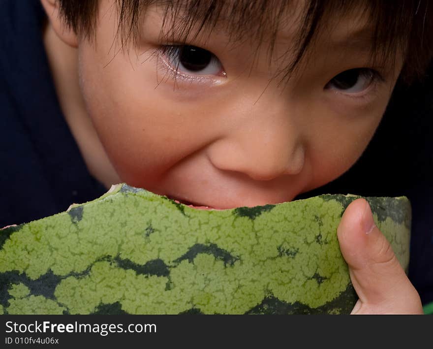 Boy eating watermelon