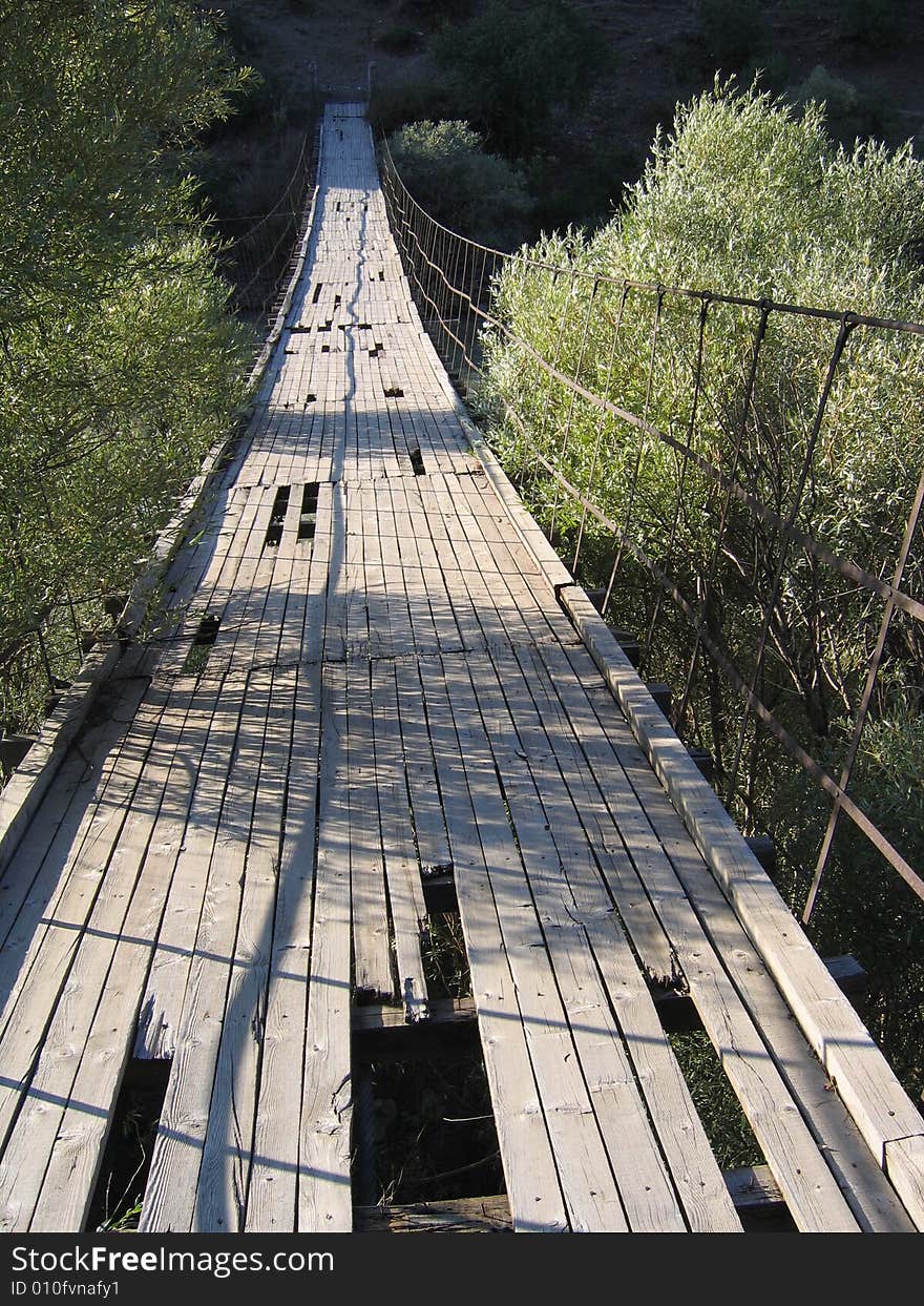 Old, wooden, dilapidated suspension bridge in central Turkey. Old, wooden, dilapidated suspension bridge in central Turkey.