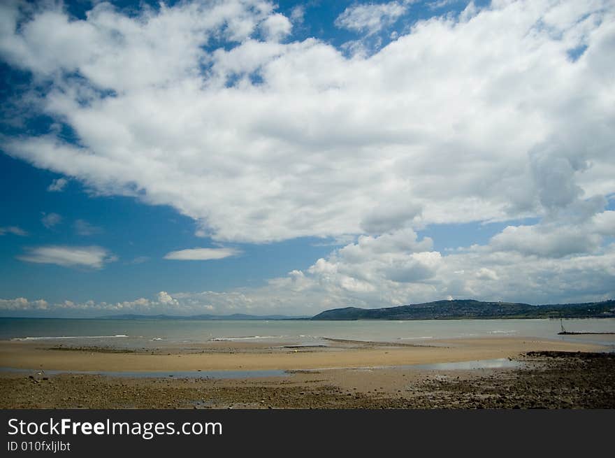 Big Clouds And Open Beach