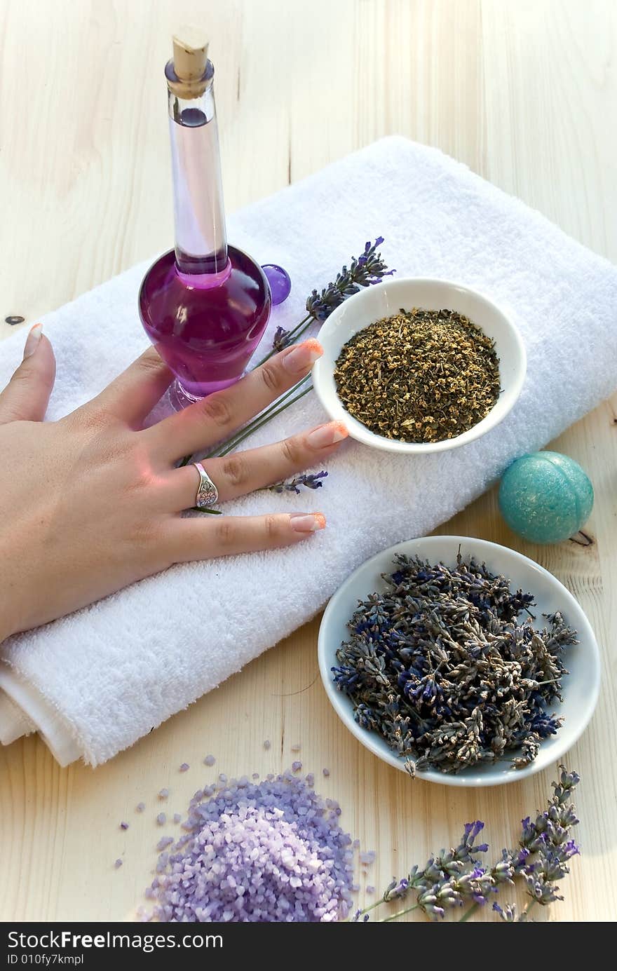 Women hand with lavender on the towel.