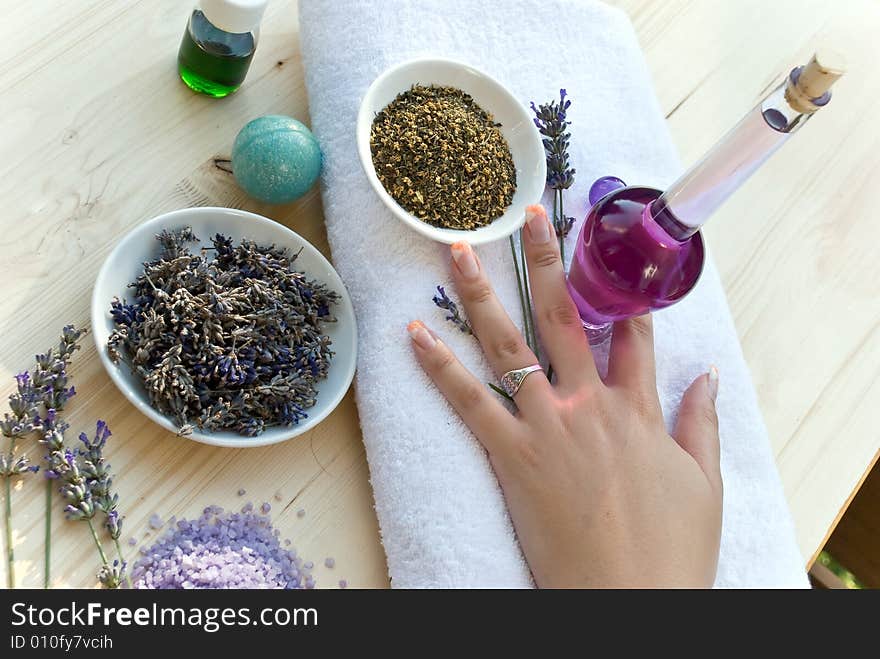 Women hand with lavender on the towel.