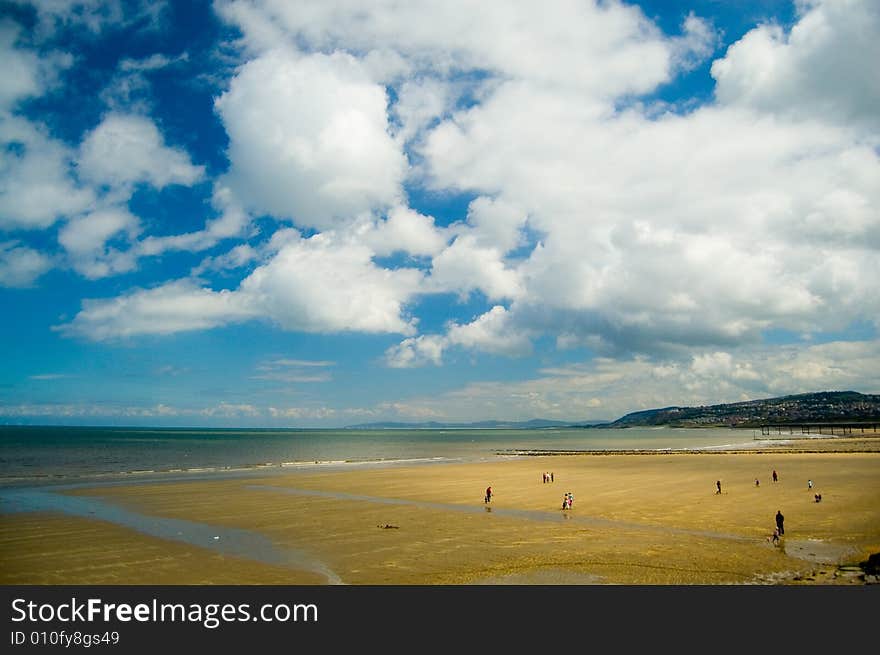 Figures on the beach