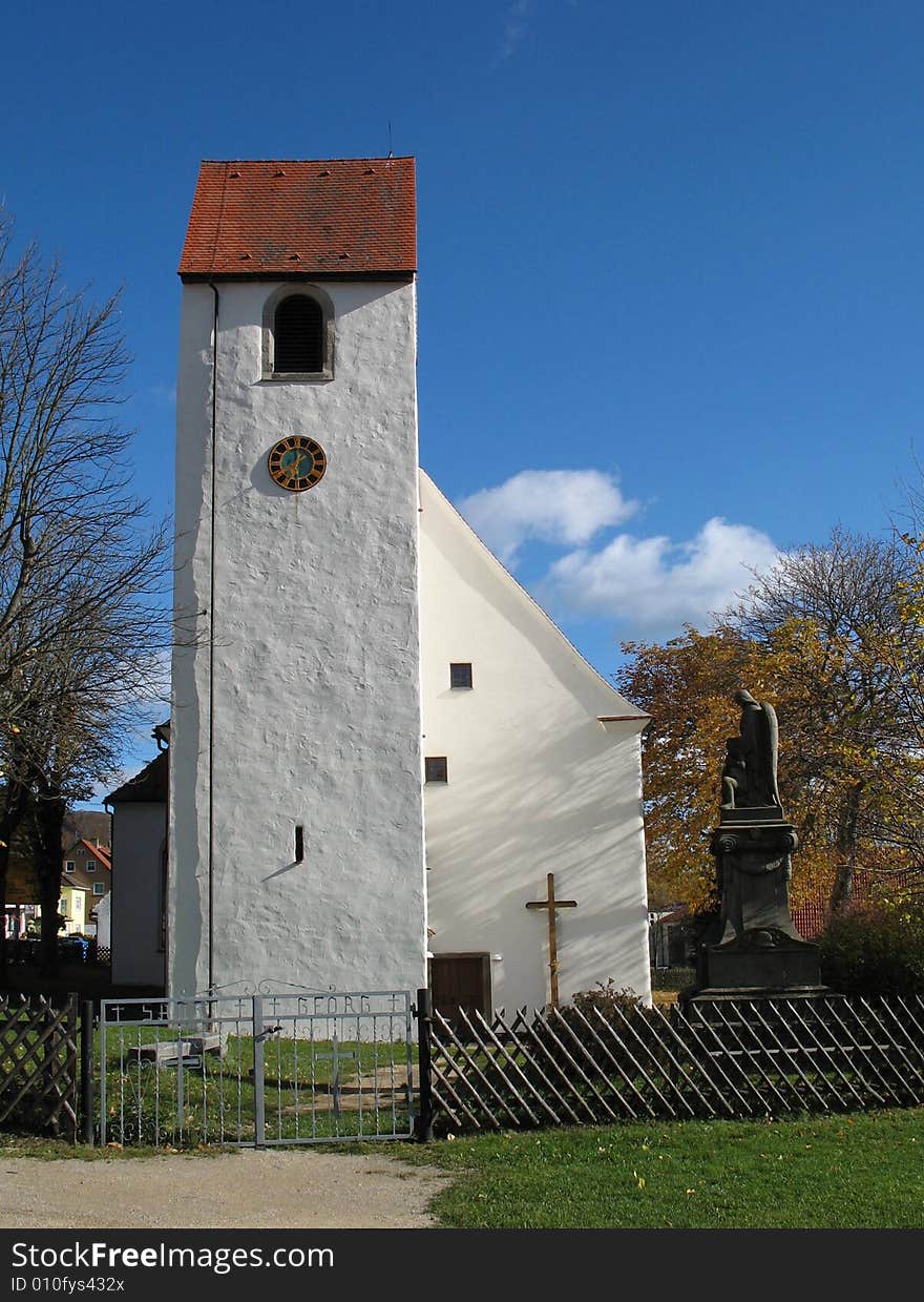 Old church in Germany, against a perfect October sky. The high tower makes for a dramatic image. Old church in Germany, against a perfect October sky. The high tower makes for a dramatic image.