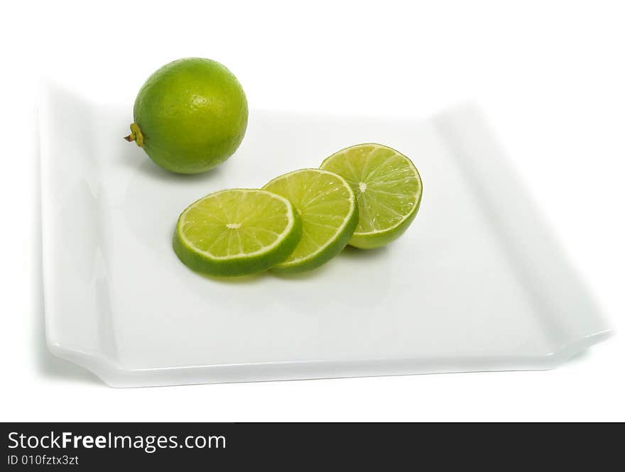 Lime slices on cutting board