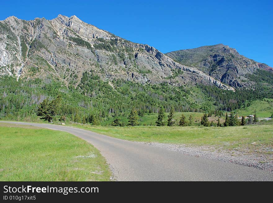 The 8-km scenic drive to the entrance of waterton lake national park, alberta, canada. The 8-km scenic drive to the entrance of waterton lake national park, alberta, canada