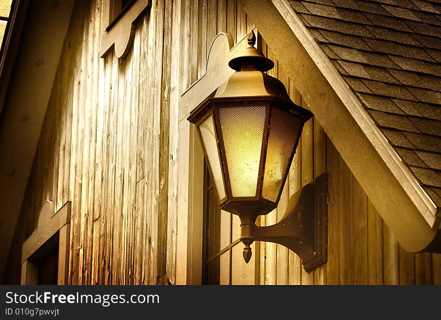 Smoke lamp mounted at the door entrance of old home. Smoke lamp mounted at the door entrance of old home