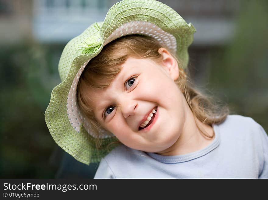 An image of a nice girl in a hat. An image of a nice girl in a hat