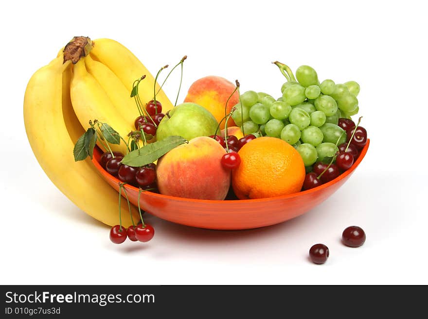 Colorful vase with fruits and berries