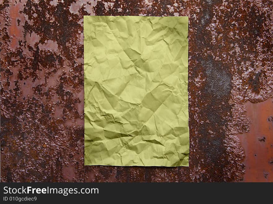 Paper sheet on rusty brown iron surface. Paper sheet on rusty brown iron surface