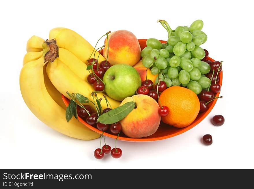 Orange vase with colorful fruits