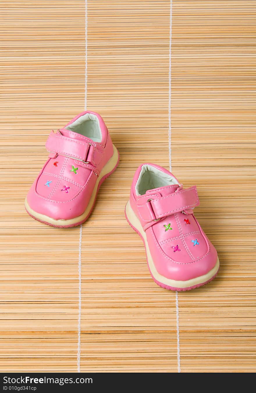 Pink children s shoes 2 on bamboo