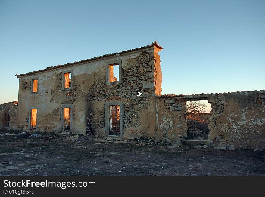 Old abandoned house wall with windows