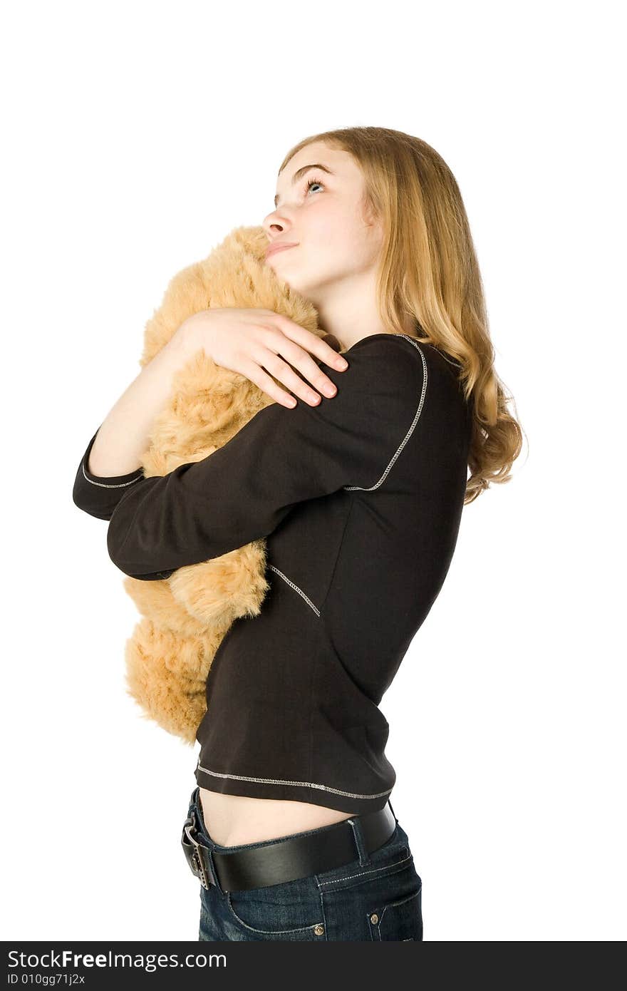 Young girl hugging a Teddy bear, isolated. Young girl hugging a Teddy bear, isolated