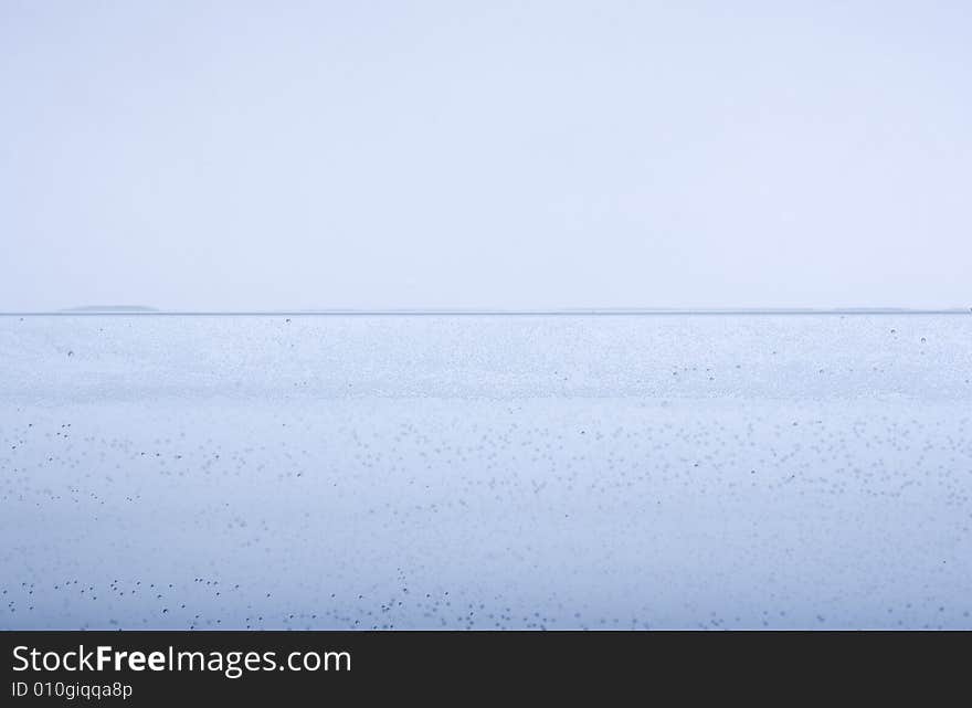 Expanse of water whit little drops on a white background