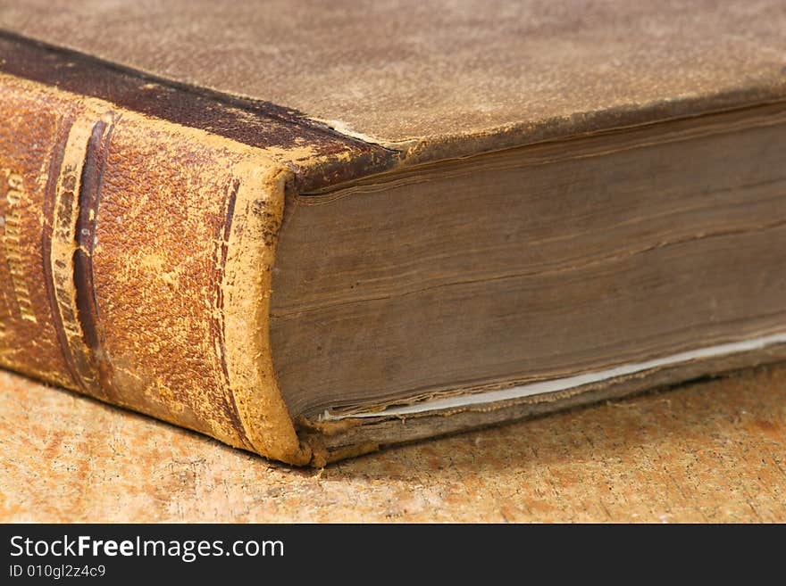 Old book in brown cover close up. Old book in brown cover close up