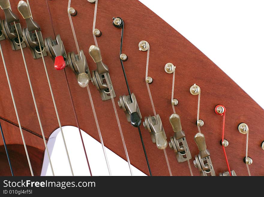 Levers and strings of folk harp close up. Levers and strings of folk harp close up