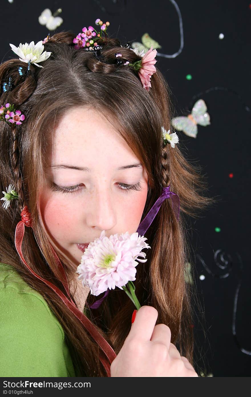 Teenage model with flowers and butterflies in her hair. Teenage model with flowers and butterflies in her hair