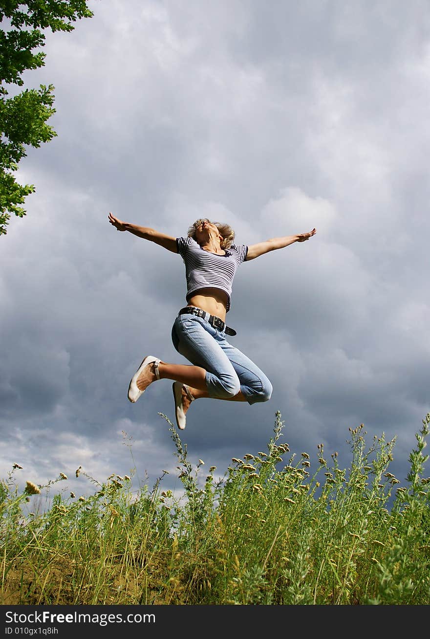 Happy Young Woman Jumps