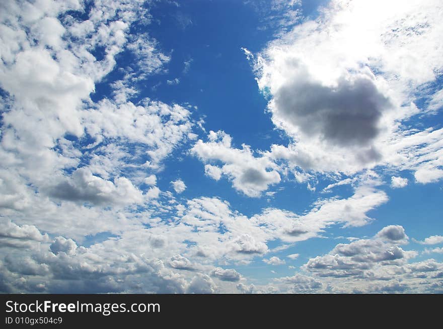 White clouds in a blue sky. Great background. White clouds in a blue sky. Great background