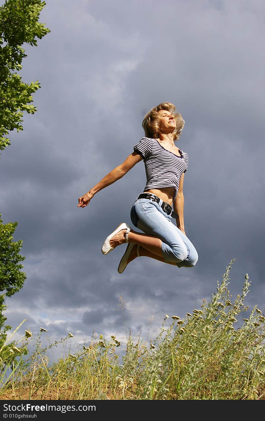 Beautiful young woman jumps