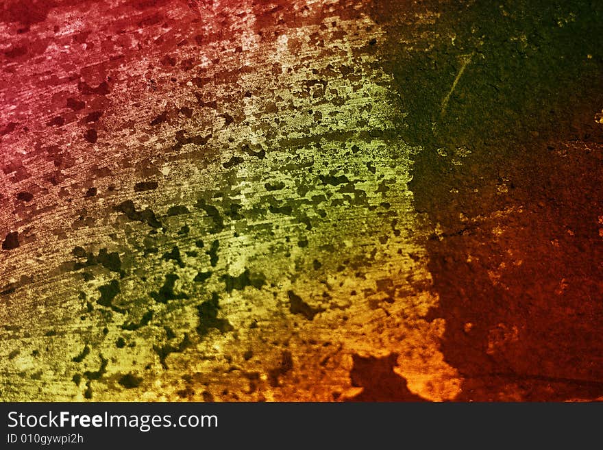 A rainbow colored rusted metal  grunge textured background. A rainbow colored rusted metal  grunge textured background