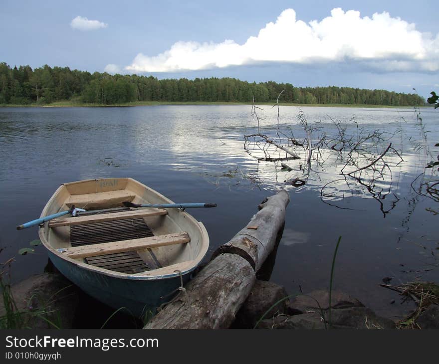 Old boat at lake coast