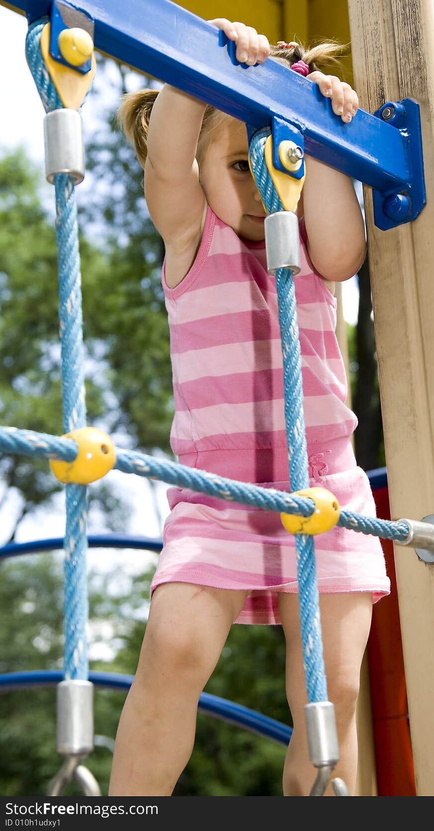 Little girl playing on playground