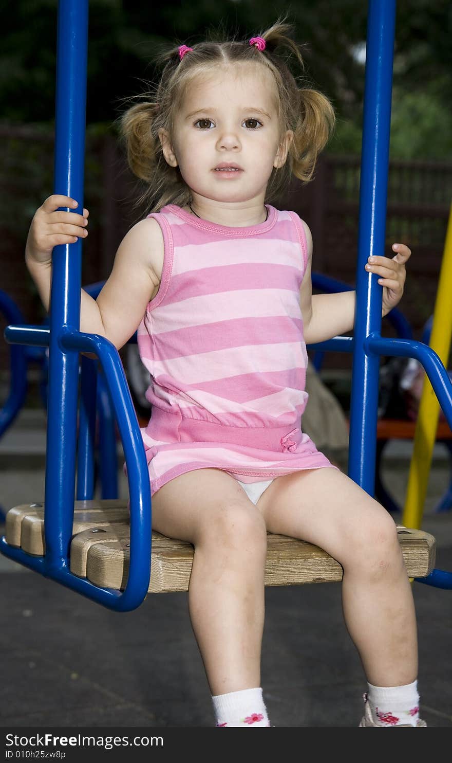 Little girl playing on playground