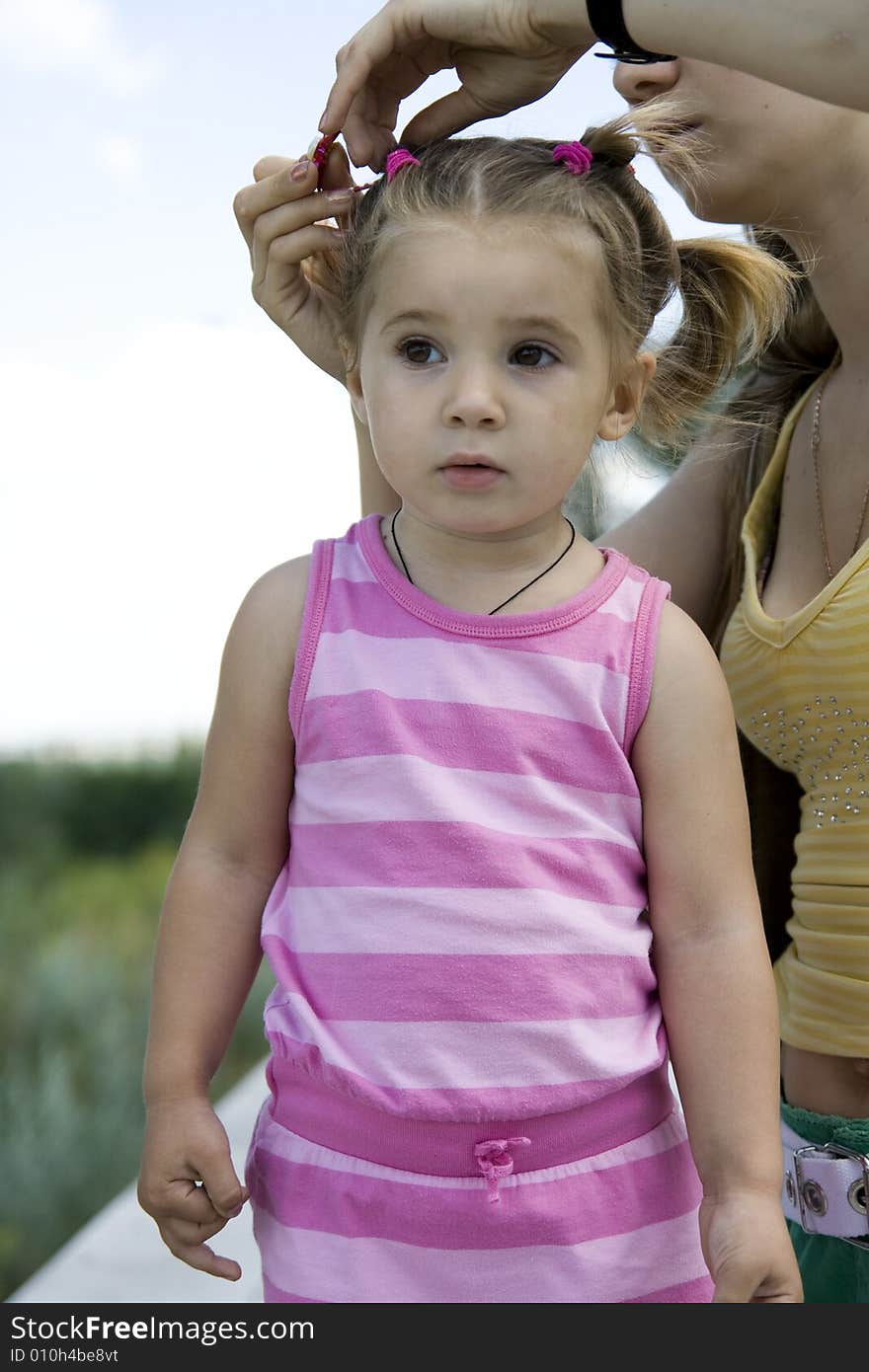 Little cute girl with mother