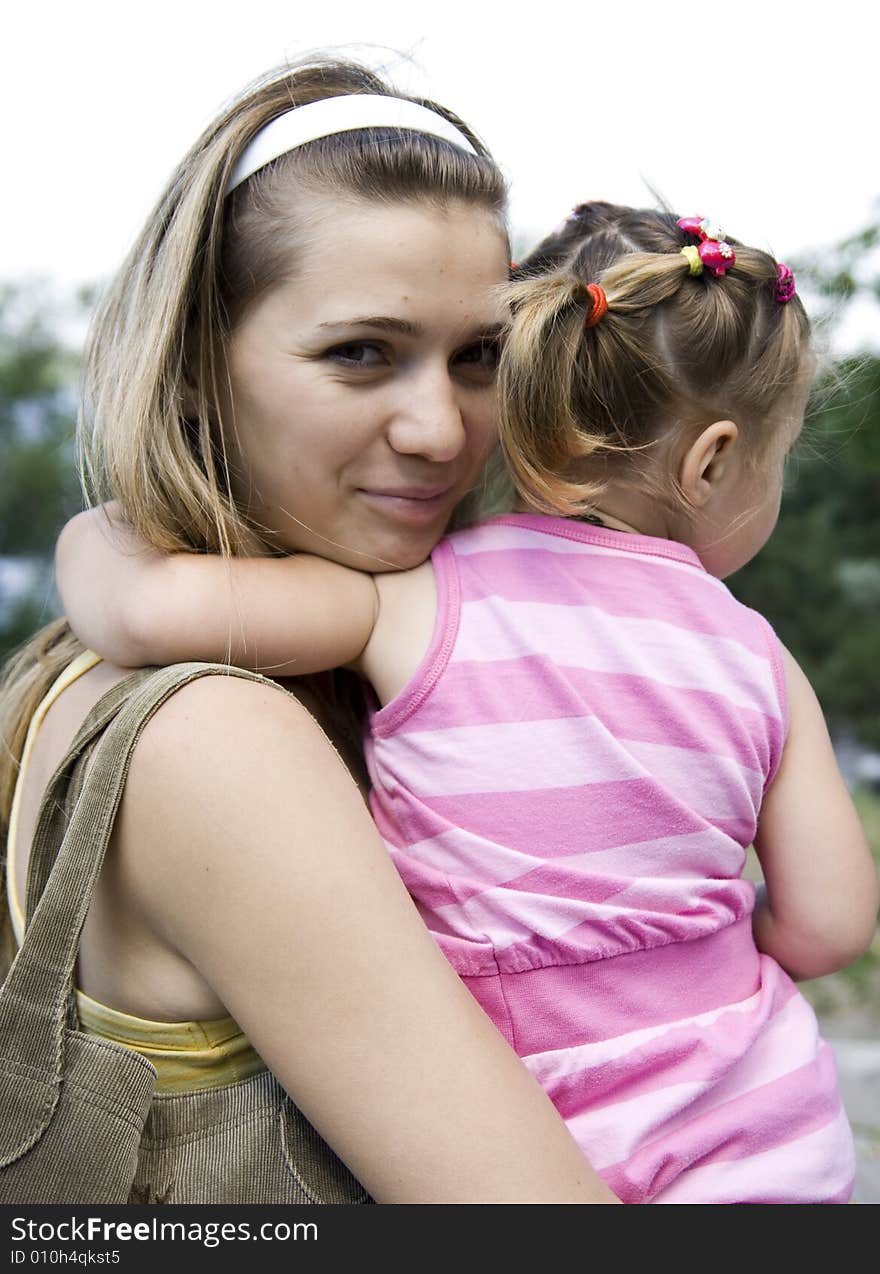 Smiling mother with her daughter. Smiling mother with her daughter