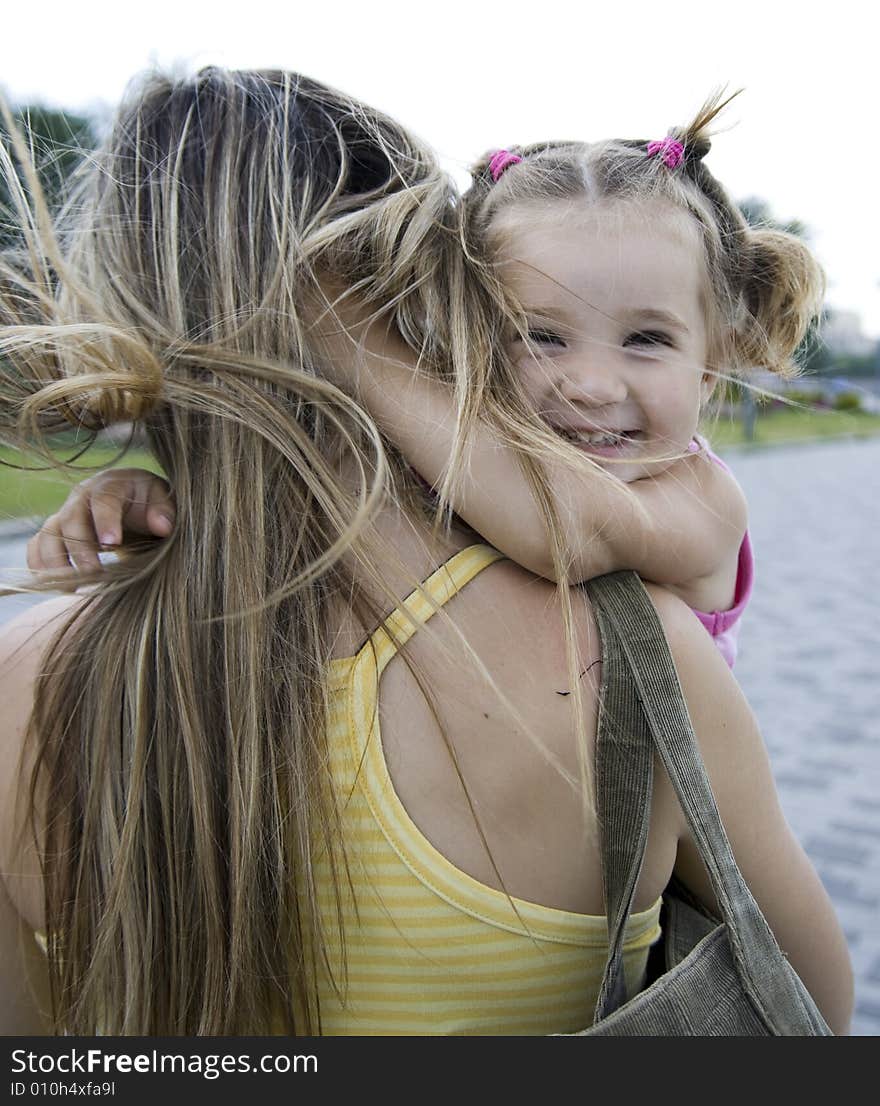 Smiling daughter with her mother. Smiling daughter with her mother