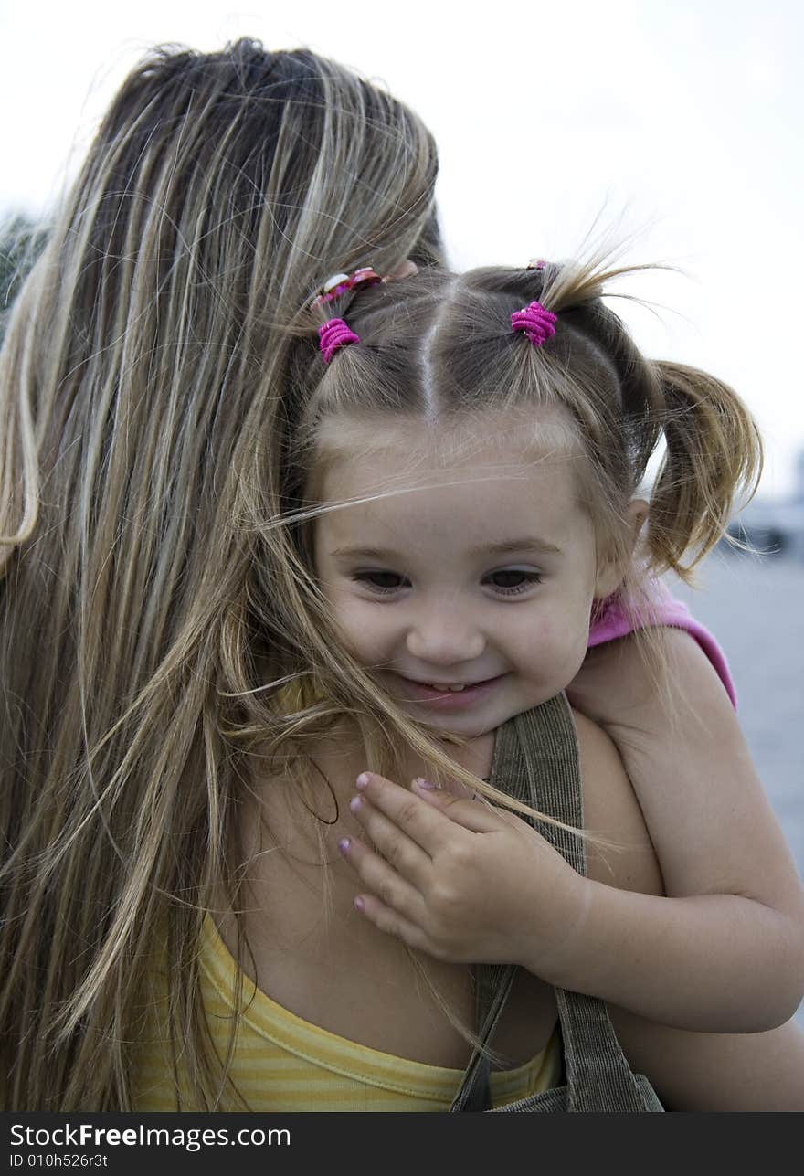 Smiling daughter with her mother. Smiling daughter with her mother