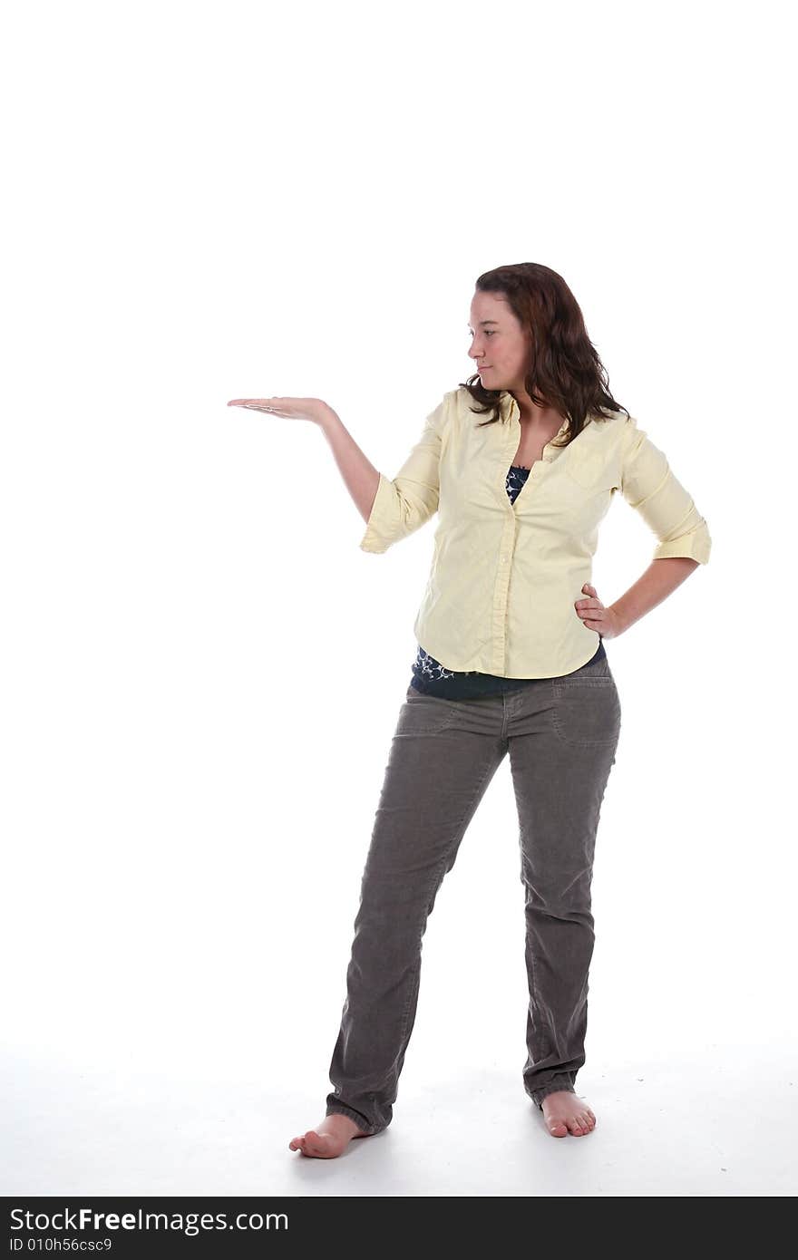 Woman standing with palm up for product placement. Woman standing with palm up for product placement